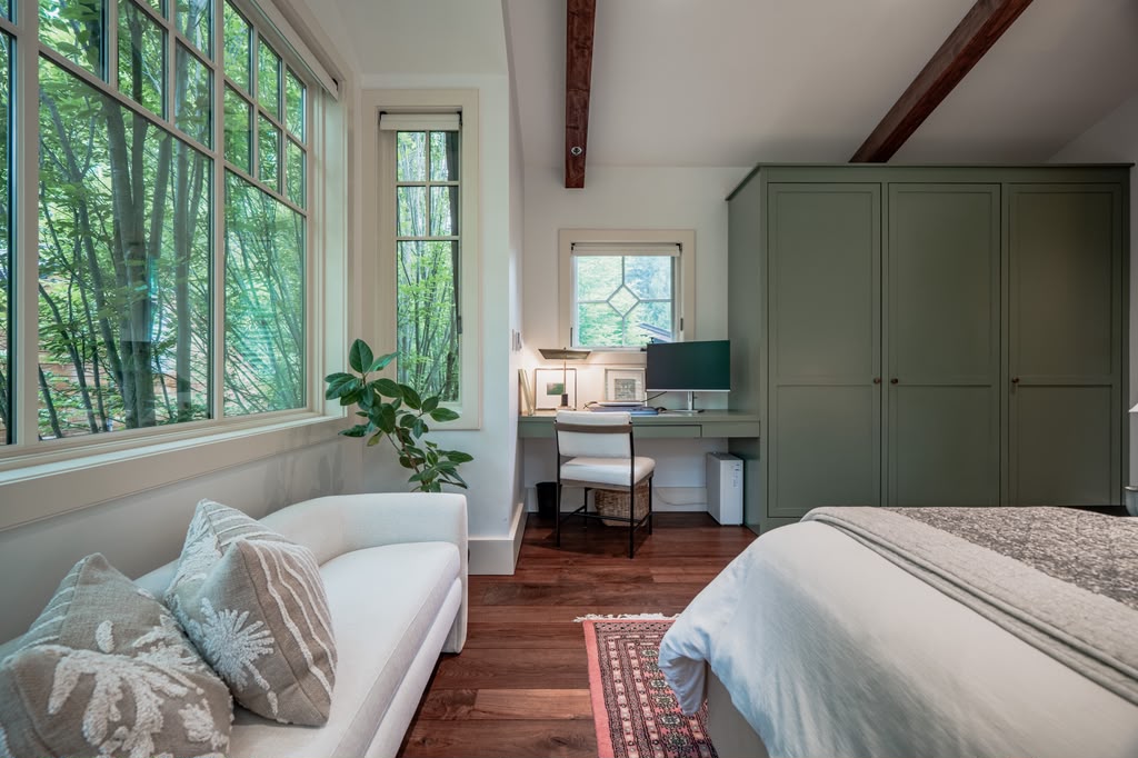 Light-filled bedroom suite addition with custom sage cabinetry in Bethesda, Maryland