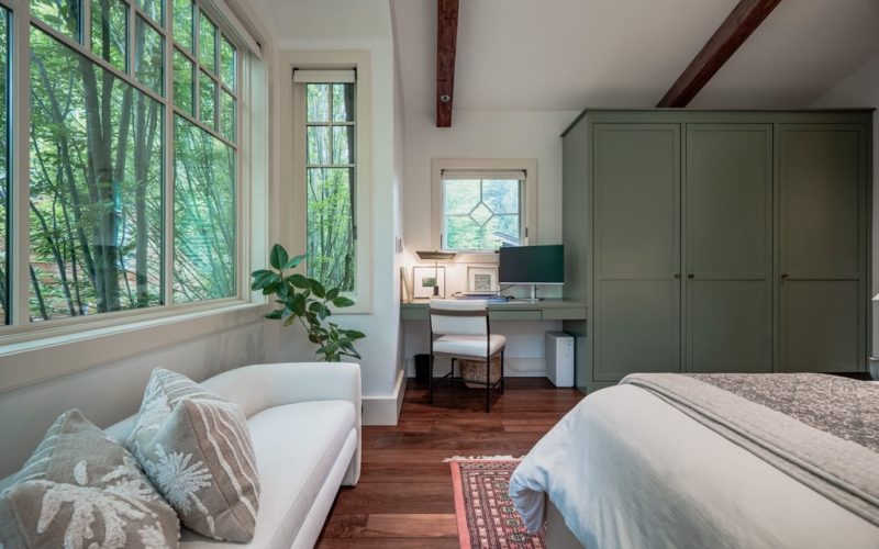 Light-filled bedroom suite addition with custom sage cabinetry in Bethesda, Maryland